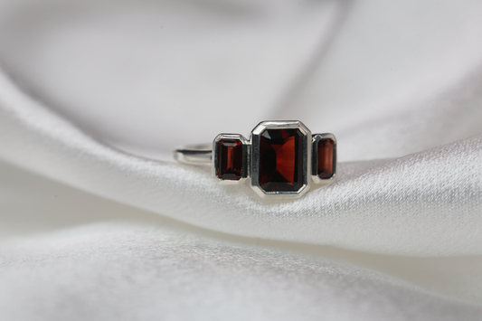 Emerald Cut Garnet Three Stone Ring